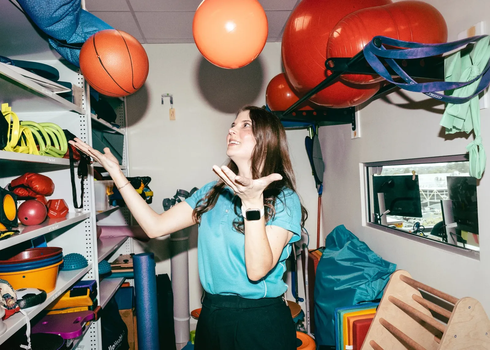 Lauren, Clinical Lead Occupational Therapist at Ability WA, in a therapy equipment room